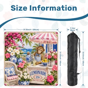 May include: A beach mat with a whimsical lemonade stand scene featuring a monkey, flowers, and the text "LEMONADE 25&cent;". The mat is 31.5 inches (80cm) square and comes with a black carrying bag, 33.5 inches (85cm) long.