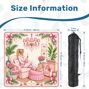 May include: A decorative mat with a pink and white floral design, featuring a woman in pajamas, a chandelier, and the text "GOOD DAYS & TAN LINES." The mat is 31.5 inches (80cm) square. A black carrying bag is included, measuring 33.5 inches (85cm) long.