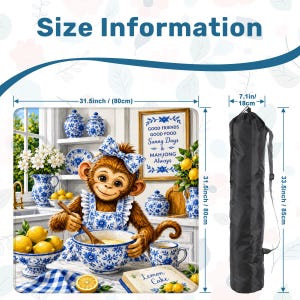 May include: A decorative kitchen scene featuring a monkey wearing a blue bow and apron, mixing batter. The scene includes lemons, blue and white china, and the text "Lemon Cake." The image is 31.5 inches (80cm) wide and 33.5 inches (85cm) tall, with a black carrying bag.