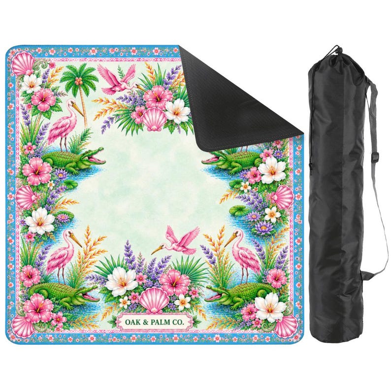 May include: A colorful beach mat with a tropical design featuring pink birds, alligators, flowers, and seashells. The mat has a blue border and the text "OAK & PALM CO." A black carrying bag is included.