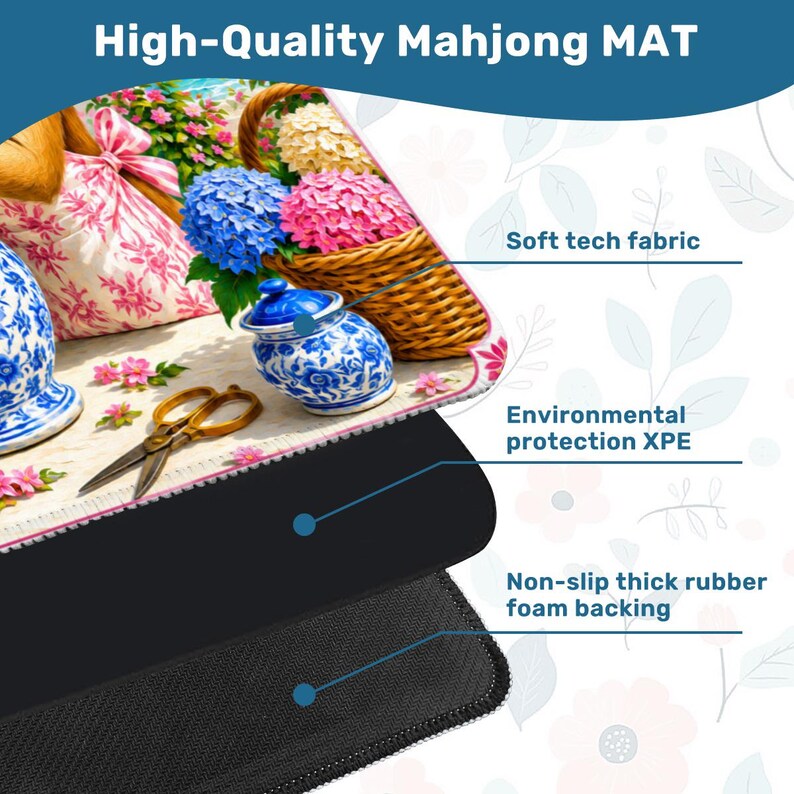 May include: A high-quality Mahjong mat with a floral design featuring blue and pink hydrangeas, a blue and white ceramic jar, and gold scissors. The mat has a soft tech fabric, environmental protection XPE, and a non-slip rubber foam backing.