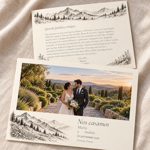 May include: A wedding announcement card featuring a photograph of a couple in formal attire standing on a stone path at sunset. The card includes black ink illustrations of mountain ranges and pine trees, with Spanish text reading Nos casamos.