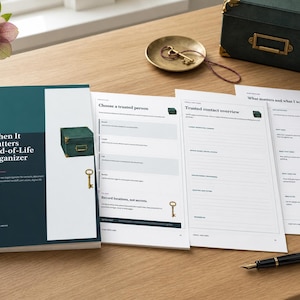 May include: A printed end-of-life organizer booklet with a dark teal cover featuring the text When It Matters End-of-Life Organizer, displayed alongside three open pages with sections for trusted contacts and personal wishes, plus a black fountain pen.