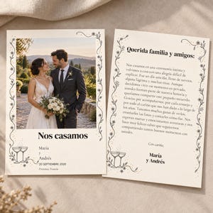 May include: Two wedding cards with cream backgrounds and black floral borders. The left card features a photo of a couple, the text 'Nos casamos', 'María y Andrés', '20 SEPTIEMBRE 2026', 'Provenza, Francia', and two champagne glasses.