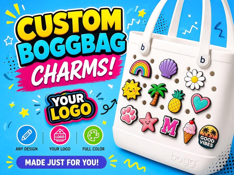 May include: White tote bag with a selection of colourful charms, such as a rainbow, seashell, and flower. The bag features the text "CUSTOM BOGGBAG CHARMS!" and "YOUR LOGO" against a blue backdrop. Additional text reads "ANY DESIGN", "YOUR LOGO", "FULL COLOR", and "MADE JUST FOR YOU!"