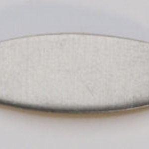 May include: A silver-toned, rectangular metal tag with rounded edges and two small holes on either side. The tag is blank and ready for personalization.