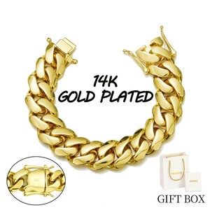 May include: A gold-plated chain link bracelet with a secure clasp. The bracelet is thick and shiny, with the text "14K GOLD PLATED" in the center. A small gift box is included.
