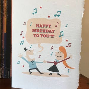 Anniversaire dansant, anniversaire chantant [ carte d'anniversaire / comédie musicale ]