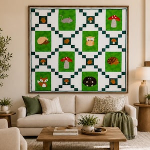 May include: A square quilt featuring a grid of green rectangular panels separated by white and dark green checkered borders. The panels display appliqued forest motifs including a mouse, owl, fox, hedgehogs, various mushrooms, and brown acorns.