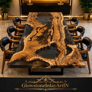 May include: A rectangular dining table featuring a live-edge wood slab with a prominent natural grain pattern, integrated with a smooth, dark, translucent resin river inlay. The table is supported by a black metal base and surrounded by eight chairs.