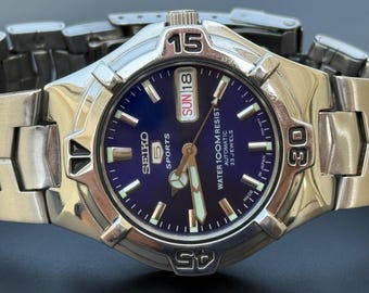 S-22 Seiko 5 Sports Water 100m Resist Automatic 23 Jewels Blue Dial Day And Date.7s36-00J0