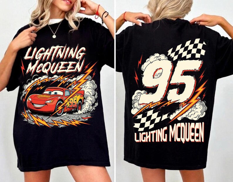 May include: Black t-shirt featuring Lightning McQueen from the Cars movie. The front graphic shows the red race car with the number 95, surrounded by lightning bolts and the text "Lightning McQueen." The back displays "95" and "Lightning McQueen" with a checkered flag.