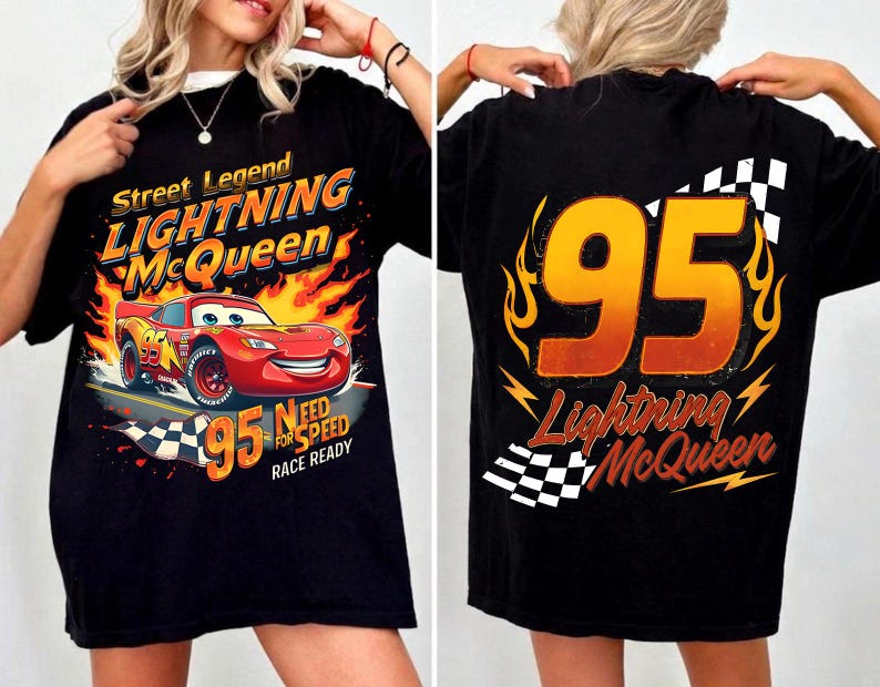 May include: Black t-shirt featuring Lightning McQueen from the movie Cars. The front graphic shows McQueen racing with flames and the text "Street Legend Lightning McQueen". The back displays the number 95 and the name Lightning McQueen.