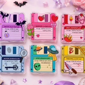 May include: Six acrylic pins shaped like vintage floppy disks, each featuring unique themes: Fantasy with a sword and dragon, Romance with roses and hearts, Spicy with handcuffs and chilli, Mystery with a key and magnifying glass, Sci-Fi with a UFO and alien, and True Crime with a knife and bloodstain.