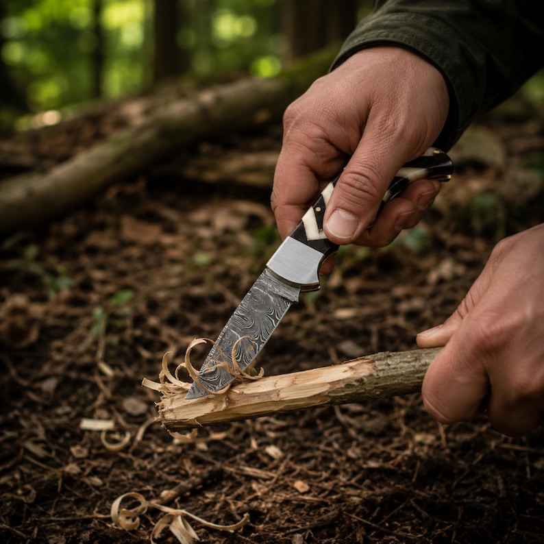 Complete outdoor utility knife set including fixed blade knife, folding pocket knife, leather sheath, and sharpening rod.