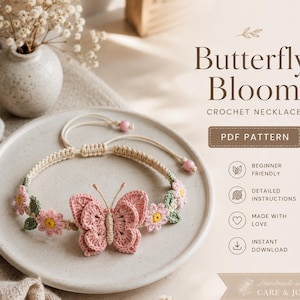 May include: A crocheted necklace with a pink butterfly and pink flowers. The necklace is beige with a macrame design. The image also includes the text "Butterfly Bloom Crochet Necklace PDF Pattern".