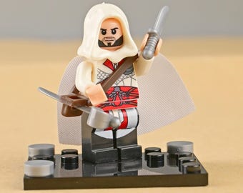 Minifigura de Ezio Auditore da Firenze, icono del Renacimiento, maestro asesino atemporal, adorno genial para pastel, regalo para hijo o novio gamer.