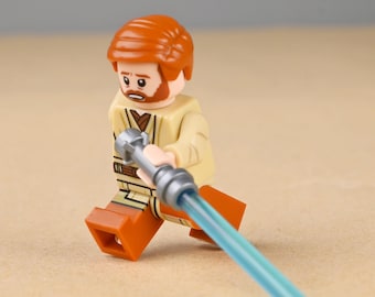 Minifigura de Obi-Wan Kenobi, Maestro Jedi, Mentor y General de las Guerras Clon, con sable de luz azul de juguete, regalo de cumpleaños único para hermano o novio.