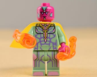 Minifigura de Visión con traje verde y capa amarilla, juguete sintético de Vengador, regalo de coleccionista para escritorio