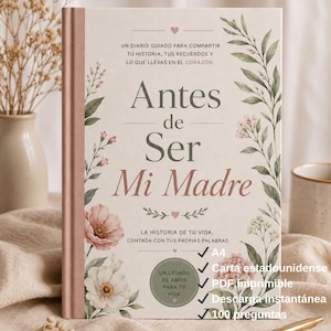 May include: A hardcover journal titled "Antes de Ser Mi Madre" with floral and leaf illustrations. The cover features text in Spanish, including "A4" and "100 preguntas". The journal has a pink spine and is surrounded by decorative elements.
