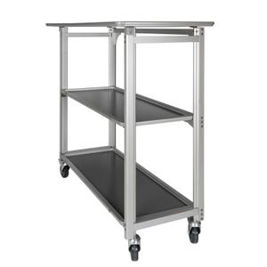 May include: A silver metal utility cart with three black shelves. The cart has four wheels for easy mobility. The shelves are rectangular and the frame is made of silver metal. The cart is designed for storage and transport.