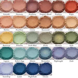 May include: A collection of 36 eyeshadows in a variety of colors, including pink, orange, yellow, green, blue, and purple. The eyeshadows are arranged in a grid of six rows and six columns. Each eyeshadow is labeled with a name, such as "Jest", "Fairytale", "Harmony", "Roseberry", "Dragon's Blood", "Prophecy", "Poppy", "Starfish", "Rikku", "Mythos", "Peachfuzz", "Citrine", "Rosewood", "Sweet Roll", "Folklore", "Panpipes", "Daffodil", "Buttercup", "Pistachio", "Fresh Mint", "Elvish", "Huntress", "Strife", "Puck", "August", "Lagoon", "Robin's Egg", "Atlantis", "Mermaiden", "Nightingale", "Dusk", "Crystal Castle", "Yuna", "Snowdrop", "Lazuli", "Nightshade", and "Oceans".