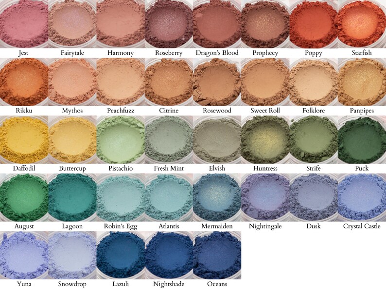 May include: A collection of 36 eyeshadows in a variety of colors, including pink, orange, yellow, green, blue, and purple. The eyeshadows are arranged in a grid of six rows and six columns. Each eyeshadow is labeled with a name, such as "Jest", "Fairytale", "Harmony", "Roseberry", "Dragon's Blood", "Prophecy", "Poppy", "Starfish", "Rikku", "Mythos", "Peachfuzz", "Citrine", "Rosewood", "Sweet Roll", "Folklore", "Panpipes", "Daffodil", "Buttercup", "Pistachio", "Fresh Mint", "Elvish", "Huntress", "Strife", "Puck", "August", "Lagoon", "Robin's Egg", "Atlantis", "Mermaiden", "Nightingale", "Dusk", "Crystal Castle", "Yuna", "Snowdrop", "Lazuli", "Nightshade", and "Oceans".