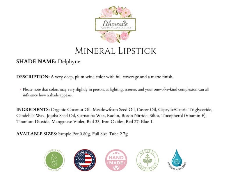 May include: A product description for a mineral lipstick in the shade Delphyne. The text describes a deep plum wine color with full coverage and a matte finish. The image includes the brand's logo and ingredient information.