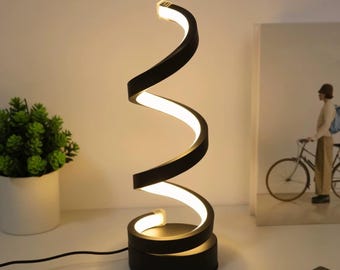 Lámpara de mesa LED moderna en espiral: luz ambiental cálida regulable para mesita de noche.