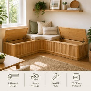 May include: An L-shaped wooden storage bench with a slatted front design and two hinged lids that open to reveal hidden compartments. The bench features a corner seat cushion, a green pillow, and a striped pillow. Text includes L-Shaped Design, Hidden Storage, Easy DIY Build, and PDF Plans Included.