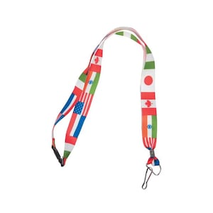 May include: A fabric lanyard featuring a repeating pattern of various international flags including the United States, Canada, Japan, and India. The strap includes a black plastic side-release buckle and a silver-toned metal swivel hook attachment.