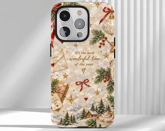 May include: A smartphone case featuring a festive mosaic-style pattern with holiday elements including pine branches, red berries, gold stars, gift boxes, and a small cabin. The text reads, It's the most wonderful time of the year.