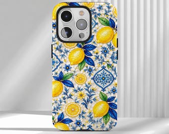 May include: A smartphone case featuring a vibrant pattern of yellow lemons, green leaves, and intricate blue and white floral tile motifs. The design covers the entire back of the case, surrounding the camera lens cutout with a detailed botanical and geometric print.