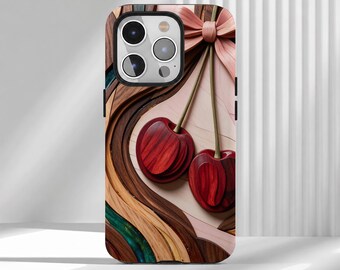 May include: A smartphone case featuring a layered wood-grain design with two deep red cherries hanging from a light pink bow. The background consists of swirling, multi-toned wood textures in shades of brown, tan, and a touch of teal.