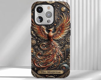 May include: A smartphone case featuring a detailed illustration of a phoenix with orange, red, and gold feathers. The background includes celestial symbols, stars, and a banner at the bottom with the text The Magician in gold lettering.