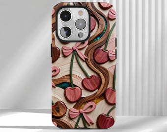 May include: A phone case featuring a layered wood-grain design with carved red cherries, green stems, and light pink bows. The surface displays wavy, flowing lines in various wood tones, interspersed with small sections of iridescent blue and gold.