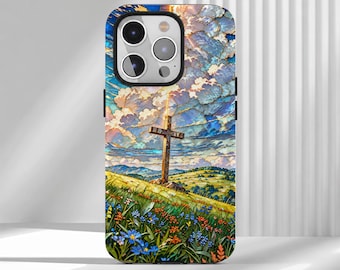 May include: A rectangular phone case featuring a vibrant, painterly landscape illustration. A wooden cross stands on a grassy hill filled with blue and orange wildflowers under a dramatic sky filled with textured, swirling clouds.