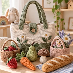 May include: A large cream and sage green crochet tote bag with a wooden button closure and daisy motifs, accompanied by crochet play food items including strawberries, a carrot, a pear, a mushroom, a loaf of bread, and a basket of flowers.