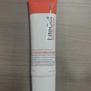 May include: A white and orange tube of LiteCell South Beach Skincare anti-aging treatment. The tube has the text "ALL-IN-ONE ANTI-AGING TREATMENT" and "Net wt. 2.54 oz". The product is designed for skin rejuvenation.