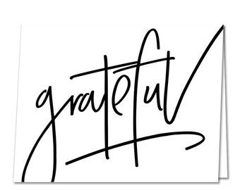 May include: A black and white printable card with the word "grateful" written in a handwritten style.