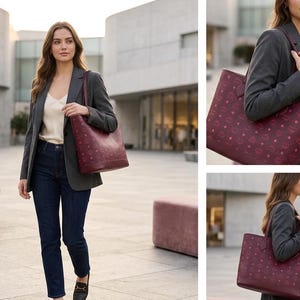 May include: A burgundy tote bag with a repeating pattern is carried by a person wearing a grey blazer, white top, and dark blue jeans. The bag has a rectangular shape with two handles. The background shows a modern building.