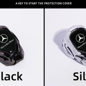 May include: Black and silver Mercedes-Benz car ignition start button covers. Each cover features the Mercedes-Benz logo and text. The black cover has a dark finish, while the silver cover has a shiny, metallic finish. The text "Black" and "Silver" are below each cover.