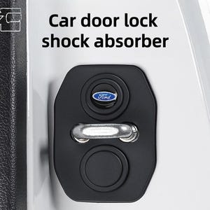 May include: Black car door lock shock absorber with a Ford logo. The text "Car door lock shock absorber" is displayed in white. The absorber is mounted on a white car door.