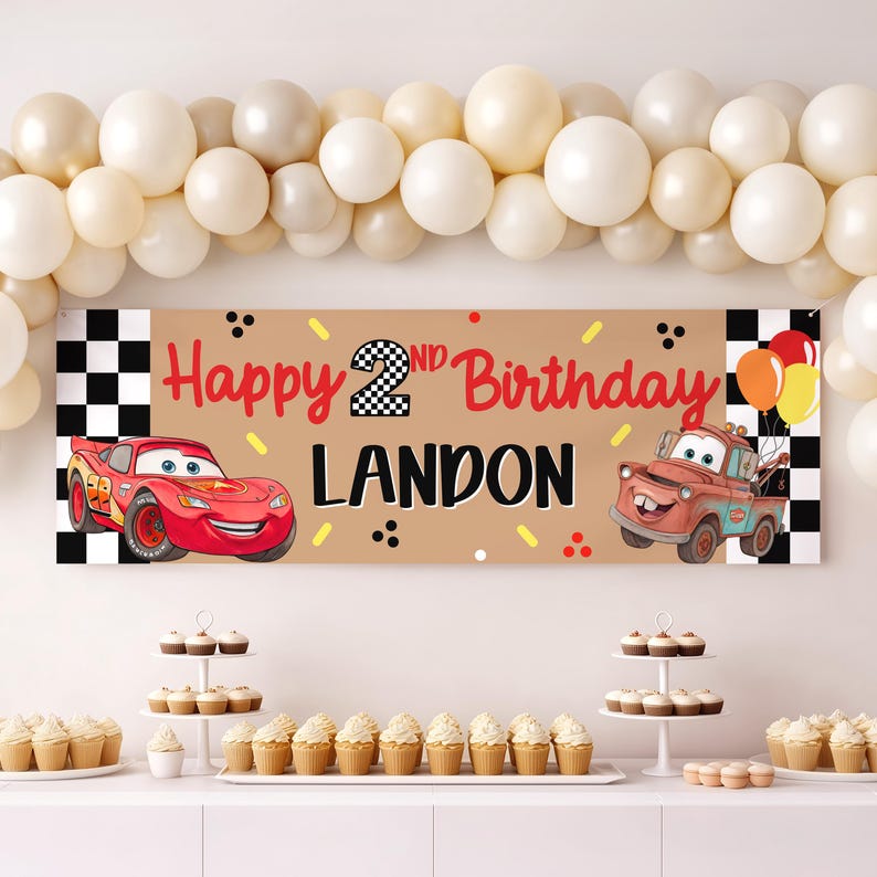 May include: A rectangular birthday banner featuring a tan background with a black and white checkered border. The text reads Happy 2nd Birthday Landon in red and black. It includes illustrations of a red race car and a brown tow truck.