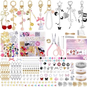 May include: A DIY keychain making kit featuring various metal charms, colorful beads, alphabet beads, lobster clasps, jump rings, chains, and pink pliers. The set includes a printed instruction sheet with text titled DIY Keychain Instructions.