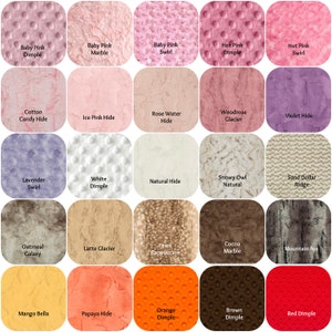 May include: A collection of fabric swatches in various colors and textures. The swatches include dimpled, marble, swirl, and hide patterns. Colors range from pinks and purples to browns, oranges, and reds. Each swatch has a label with its name.