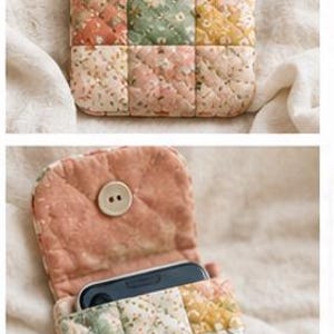 May include: A quilted fabric phone pouch featuring a patchwork design of floral patterns in shades of peach, sage green, and cream. The pouch has a flap closure secured by a round wooden button and contains a black smartphone inside.