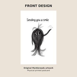 May include: A white postcard featuring a black sketch of a fuzzy, long-haired creature with large eyes waving one arm. Above the creature, the text reads, Sending you a smile. The design is centered on the card, which is labeled as original Marbleroads artwork.