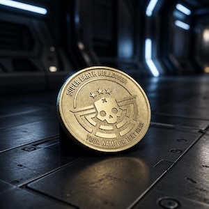 May include: A gold coin featuring the text "SUPER EARTH HELLDIVER" and a skull emblem. The coin also has the text "YOUR NAME OR TEXT HERE" and three stars. It rests on a dark, metallic surface with a futuristic aesthetic.