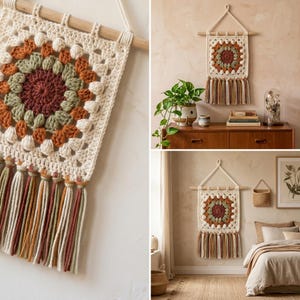 May include: A cream-colored, square crochet wall hanging with a central floral design in shades of brown, green, and orange. The piece is adorned with a wooden dowel and hanging tassels in matching colors, creating a bohemian aesthetic.